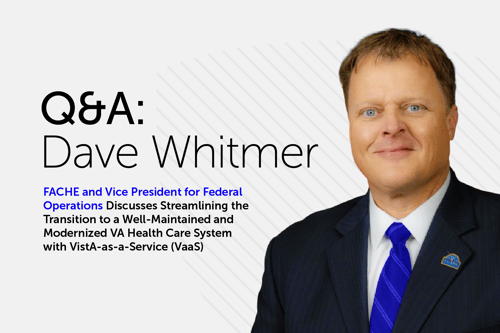 Promotional Q&A banner featuring a man in a dark suit with blue tie against a white background, with text identifying him as